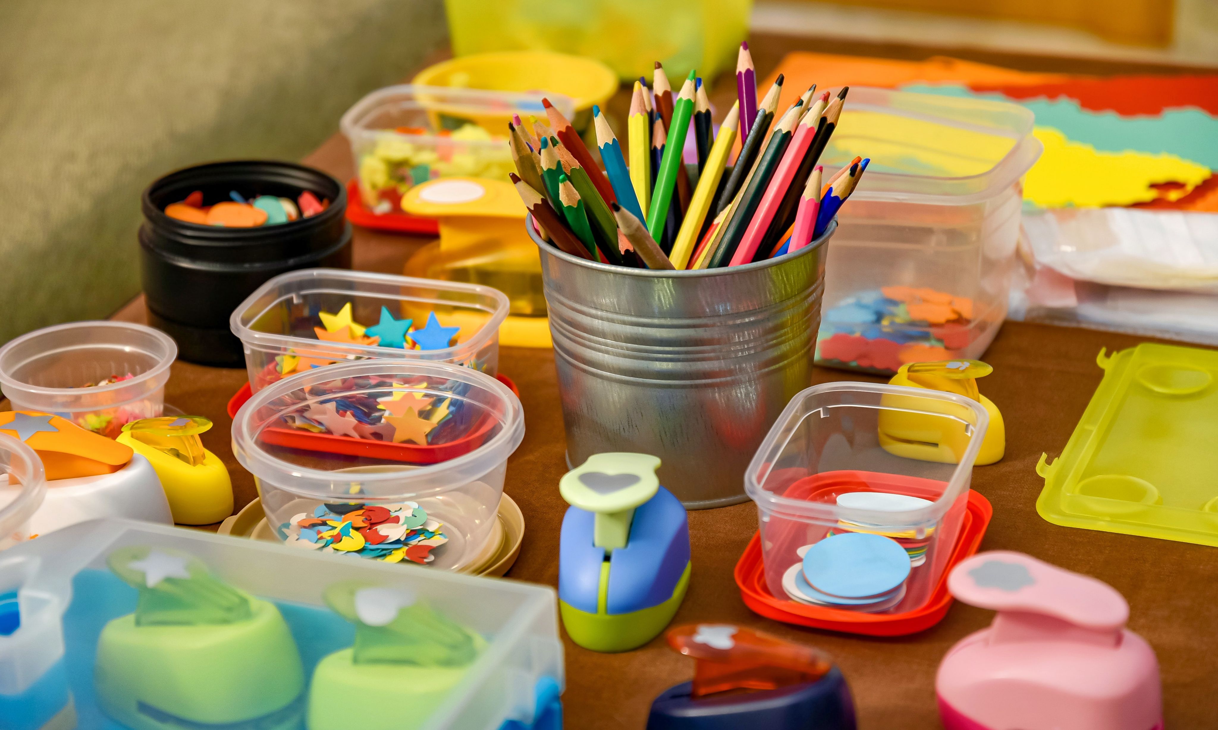 assorted color pencils in clear plastic container